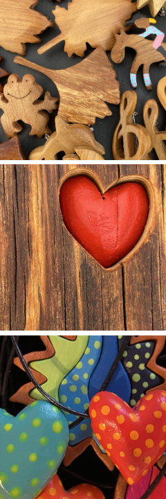 Arbeitsbeispiele Motivbroschen aus Holz.Herzen und andere Motive, bunt als Halskette.Rotes Herz eingefasst in einem kleinen Holzstück.